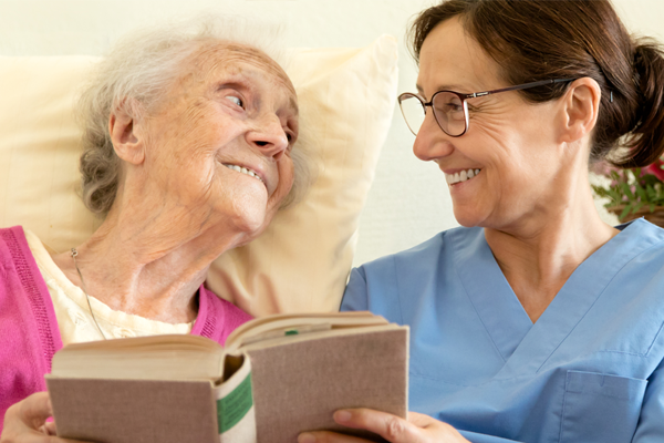 patient and nurse reading